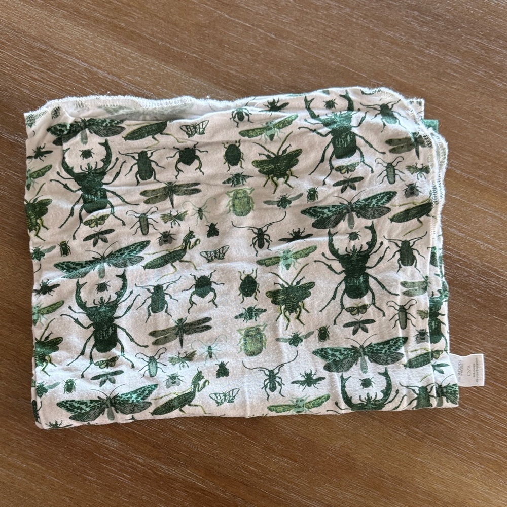 Kate Quinn green insect swaddle blanket